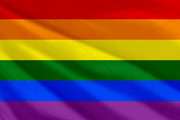 Waving LGBT flag. LGBT flag close-up.. The gay pride rainbow flag. Rainbow flag - Фото, изображение