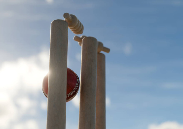 Una bola de cricket rojo golpeando grillos de madera con las fianzas de desalojo en un fondo cielo día - 3D render - Foto, Imagen