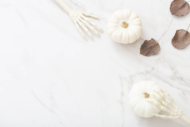 white halloween pumpkins with decor on marble background - Фото, изображение