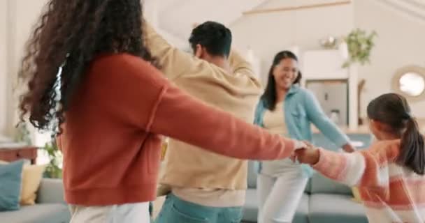 Dancing, circle and kids with parents for activity together with happiness or crazy at laughing at house. Family, energy and children for fun at apartment for entertainment or freedom and goofy - Filmati, video