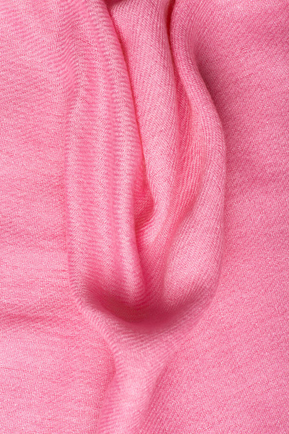 Pink soft fabric shaped as female genital organs, vulva and labia, vagina concept. High quality photo - Foto, imagen
