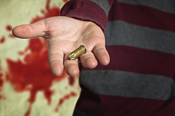 Bullet in hand - Photo, image