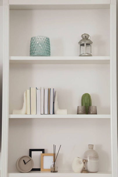 Stylish shelves with different decor elements. Interior design - Foto, Bild