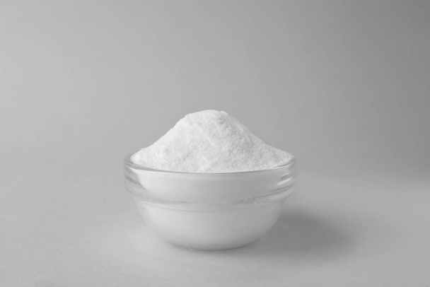 Bowl of sweet fructose powder isolated on white - Foto, Bild