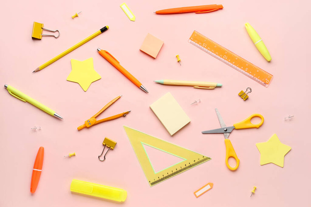 Composition with stationery supplies on pink background - Фото, зображення
