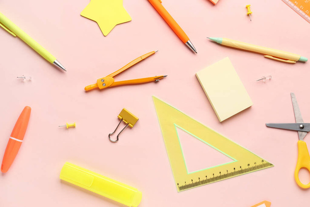 Composition with stationery supplies on pink background - Фото, изображение