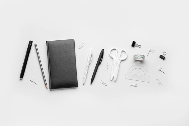 Set of different stationery with notebook on light background - Photo, Image
