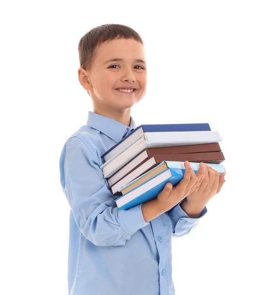 Little schoolboy with books on  white background - 写真・画像