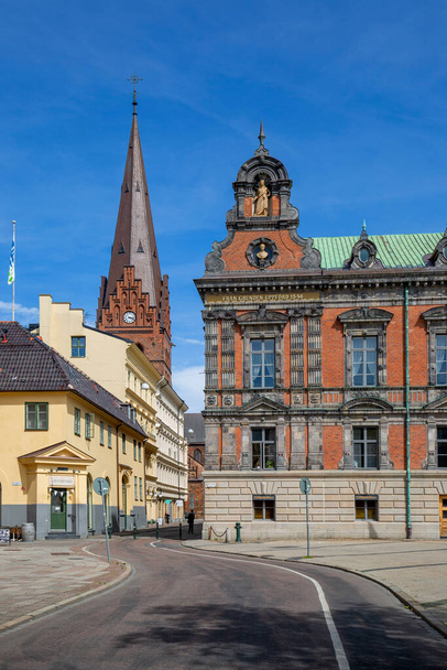 Malmo, Sweden - June 24, 2019: Stortorget, Great Square with historic Town Hall and tower of 14th century St. Peter's Church - Fotó, kép