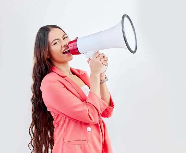 Portrait, megaphone or woman shouting an announcement, speech or sale on white background. Scream, attention or voice of girl with news or broadcast of opinion on mockup space talking on mic speaker. - Fotografie, Obrázek