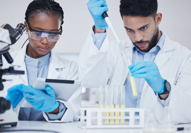 Man, black woman or scientists with test tubes in research for medical, experiment assessment or innovation. Tablet, studying biotechnology or researchers team in laboratory for science development. - Фото, зображення