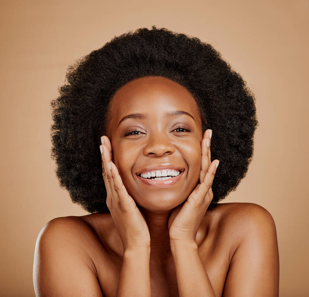 Portrait, happy black woman and touch face for skincare, aesthetic glow and soft dermatology on brown background. Female model, natural beauty and afro hair in studio for shine, facial and self care. - Foto, immagini