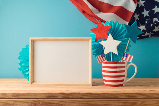 Happy Independence Day, 4th of July celebration concept with mock up frame and decorations on wooden table over USA flag background - Photo, Image