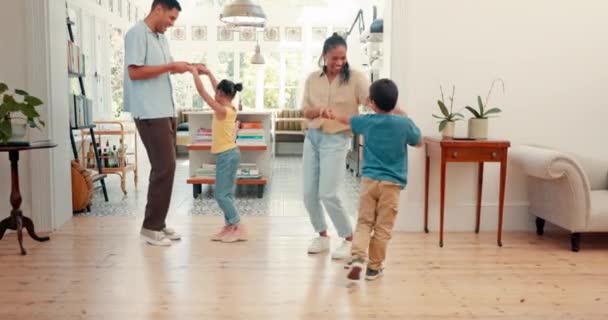 Home, family and parents with kids, dance and celebration with energy, streaming music and playful. Dancing, mother and father with children, bonding and quality time with love, wellness and happy. - Filmmaterial, Video
