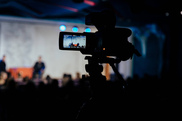 video recording of a concert, video camera, event, video recording - Foto, afbeelding