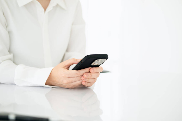 Modern workplace woman using mobile phone in office.Wide horizontal Panorama cover and header web Banner. Copy space - Foto, immagini