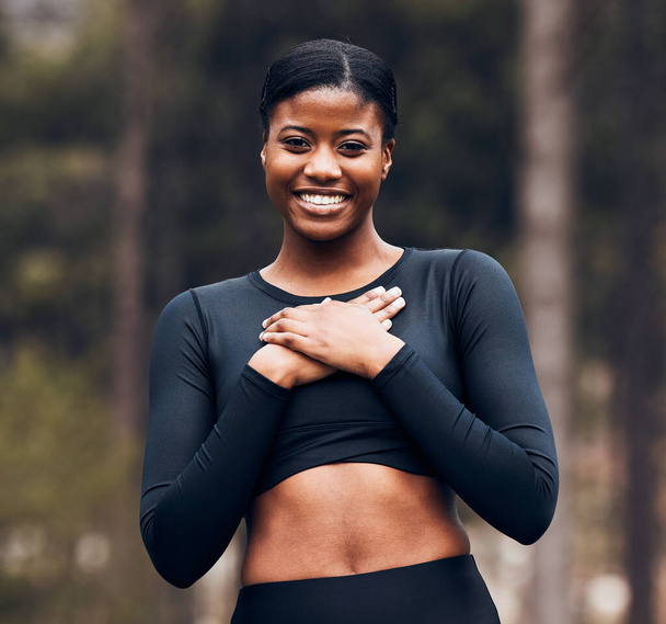 Smile, healthy and portrait of black woman athlete happy for outdoor fitness, exercise and workout in forest or woods. Wellness, health and young female person mindful, freedom and calm for training. - Foto, immagini