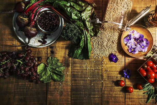 Vegan fresh cooking ingredients on a wooden table - Photo, Image