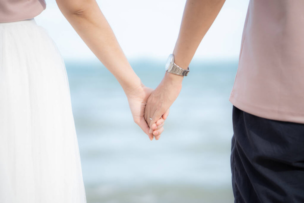 Lovers couple holding hands between boyfriend and girlfriend, love and romance concept - Fotografie, Obrázek