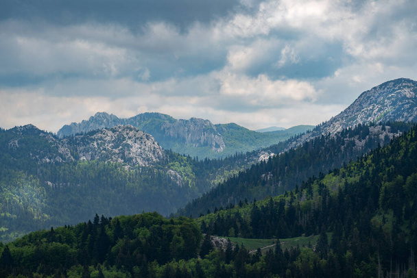 View of Velebit National Park under dramatic cloudsi n early summer. - Foto, afbeelding