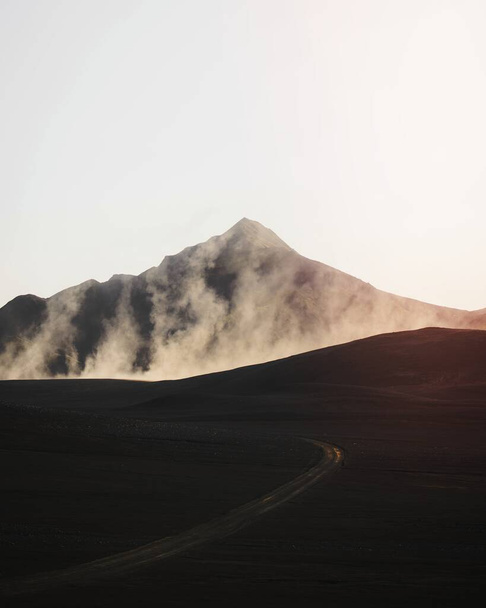 Curve road with a misty volcanic drone shot - Photo, Image