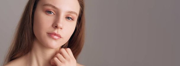 Smooth skin. Natural beauty care. Nude makeup. Nourishing face treatment. Pretty woman with nude color eyeshadow and lipstick posing isolated beige empty space. - Fotoğraf, Görsel