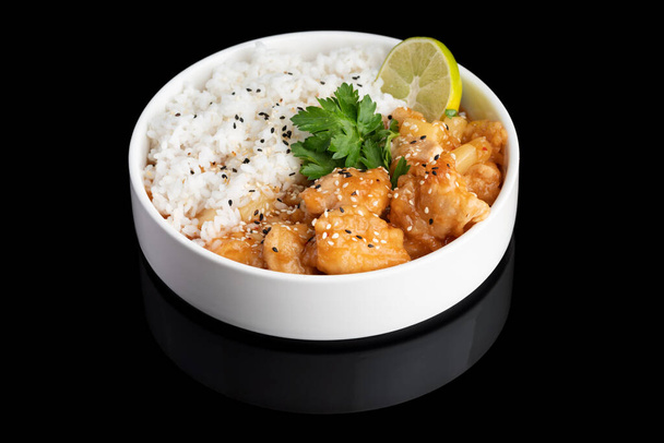 stir-fried shrimps with garlic and shrimps paste with rice on a black background with reflection. menu restaurant. - Foto, Imagen