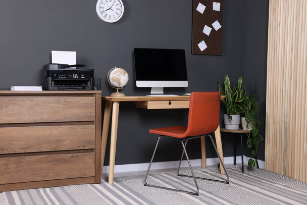 Stylish workplace with modern computer and printer at home - Foto, imagen