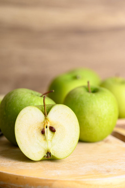 Green apple fruit on cutting wooden board, Healthy fruit - Фото, изображение
