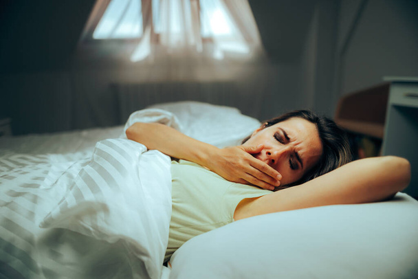 Tired Woman feeling Sleepy and Yawning in the Morning  - Foto, immagini