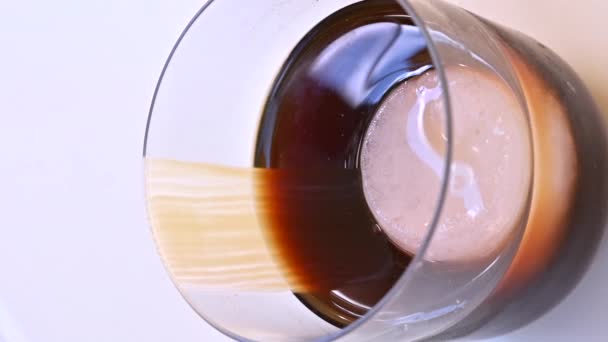 Glass with cold brewed coffee and ice - Footage, Video