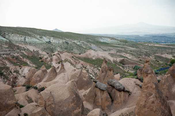 Fantastic spring view of Cappadocia, cloudy overcast beautiful sky. Beautiful valley morning scene in May. - 写真・画像