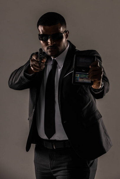 Undercover Law Enforcement Special Agent with weapon.  a secret service agent. secret service security bodyguard agent.  Portrait of secret agent standing. - 写真・画像