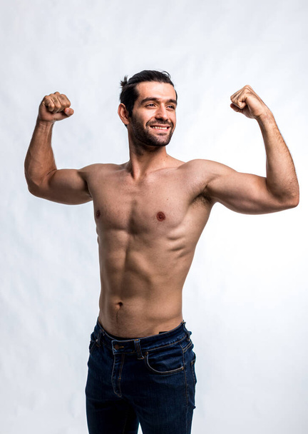 Fit and handsome man with beautiful torso. Strong and handsome ,fit and sporty bodybuilder man.  Man Fitness Model Torso showing six pack abs - Fotografie, Obrázek