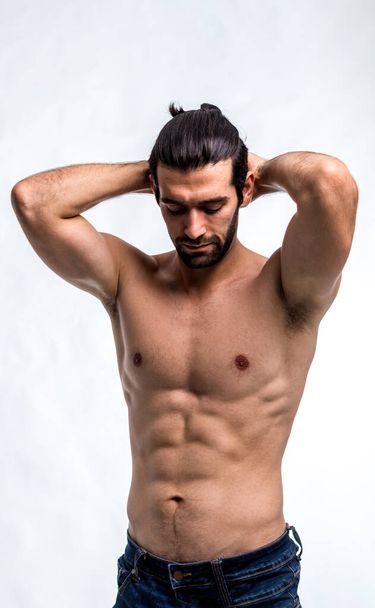 Fit and handsome man with beautiful torso. Strong and handsome ,fit and sporty bodybuilder man.  Man Fitness Model Torso showing six pack abs - Foto, afbeelding