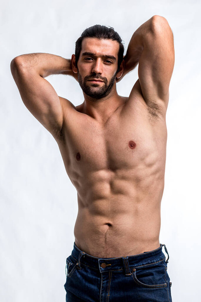 Fit and handsome man with beautiful torso. Strong and handsome ,fit and sporty bodybuilder man.  Man Fitness Model Torso showing six pack abs - Φωτογραφία, εικόνα