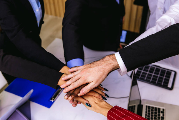 People putting their hands together. Friends with stack of hands showing unity and teamwork. Business people join hand together during their meeting. Team work concept. Business people joining hands. - Foto, imagen