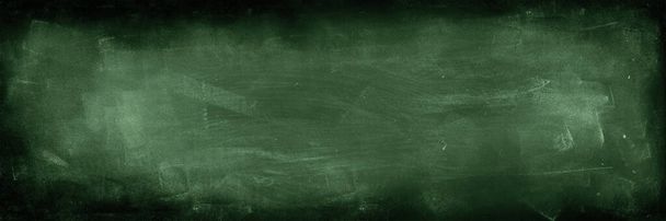 Chalk rubbed out on green chalkboard background - Photo, Image