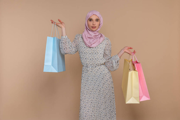After shopping. Slim pretty young woman with shopping bags - Zdjęcie, obraz