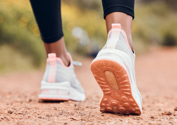 Shoes, fitness and person walking or hiking for outdoor exercise, workout or training as health and wellness. Sneakers, closeup and feet of active sports athlete or runner running a marathon. - Foto, Imagen