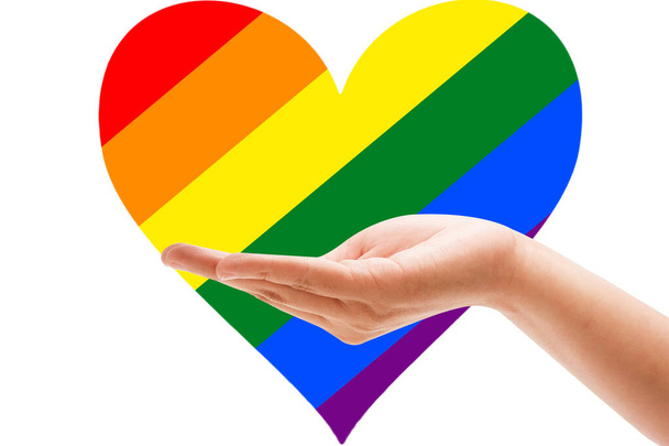 Hand-Regenbogenfaust für PRIDE Monat und die LGBTQIA + Bewegung. Stolzer Tag für die Freiheit der Sexualität, das Fest der Vielfalt der Liebe und den Kampf für die Menschenrechte - Foto, Bild