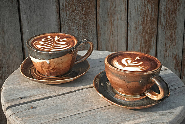Selective focus cup of hot latte art coffee,focus at white foa - Φωτογραφία, εικόνα