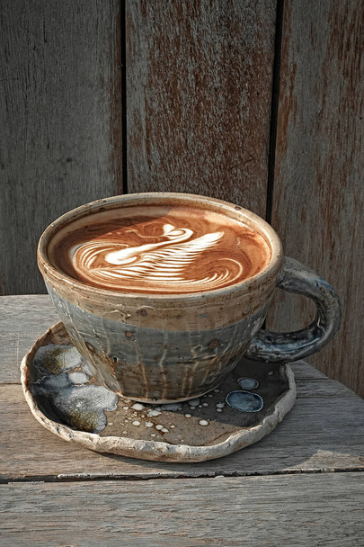 Selective focus cup of hot latte art coffee,focus at white foa - 写真・画像