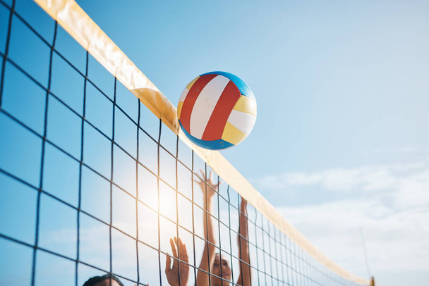 Volleyball, net with sports and fitness, blue sky and people outdoor playing game with training and summer. Exercise, athlete and competition, match with ball and active, workout and team tournament. - Foto, afbeelding