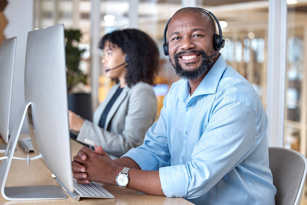 Call center, portrait of black man and smile at computer for customer service, business support and contact us in CRM office. Happy telemarketing agent at desktop for consulting in coworking agency. - Fotografie, Obrázek