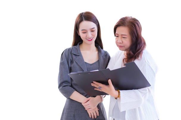 Young Asian business woman stands and talk to senior manager to consult about work intently with isolated on white background. - Photo, Image