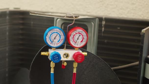 Close up of manifold meters used for checking air conditioner freon in need of service. Set of barometer high or low refrigerant levels benchmarking hvac system internal part - Footage, Video