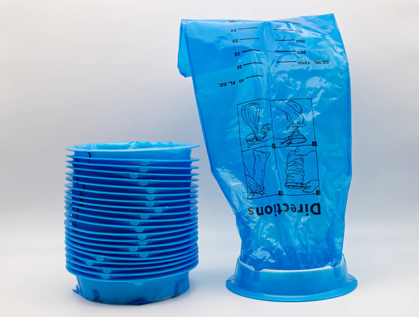 Blue plastic vomit bag isolated on white background. - Photo, Image