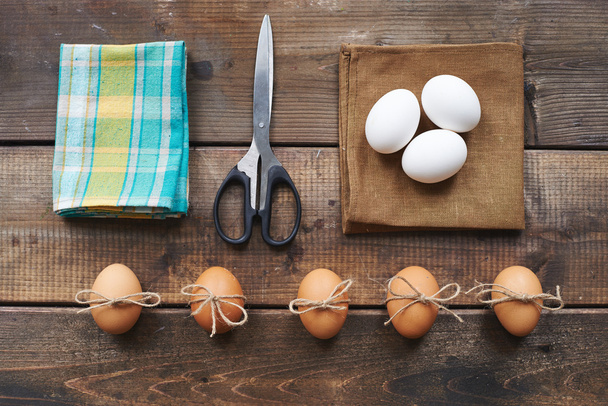 Eggs, scissors, linen and cotton napkins - Photo, Image