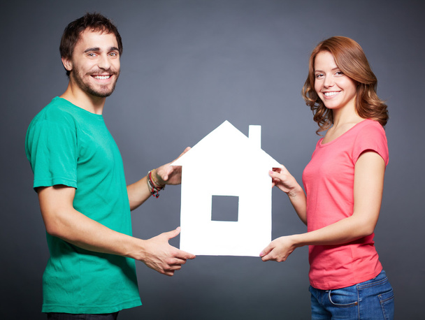 Couple showing paper house - Photo, Image